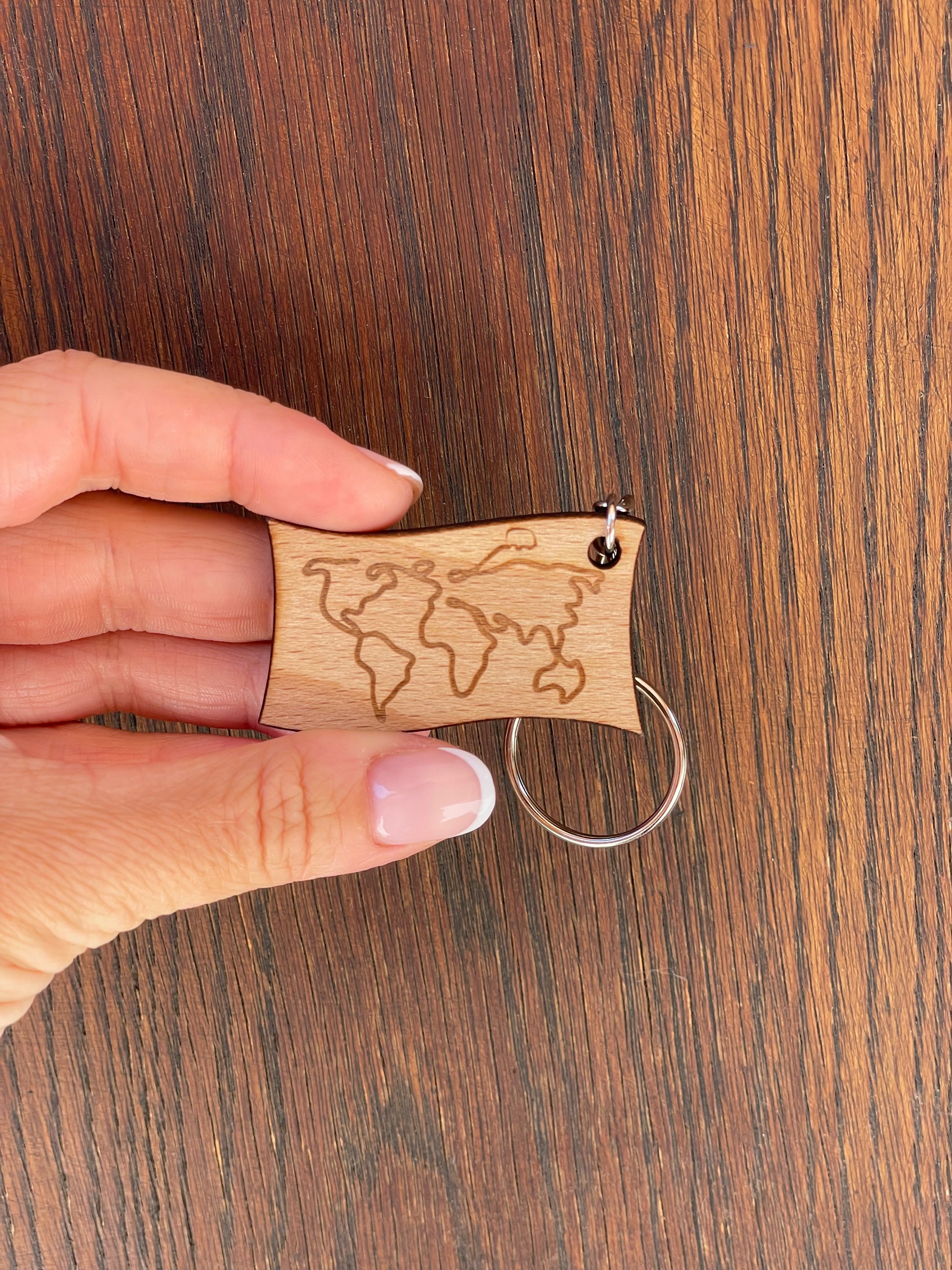 Porte-clé "Carte du monde" 1 chance de gagner le van